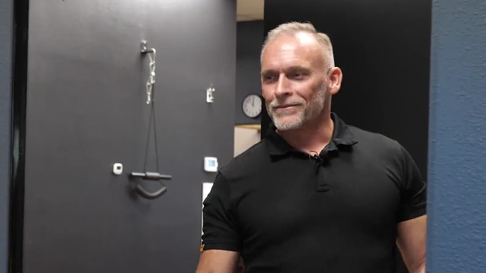 Dr. Steve Van Laecken DC smiling in a hallway at SpinalWorks Chiropractic
