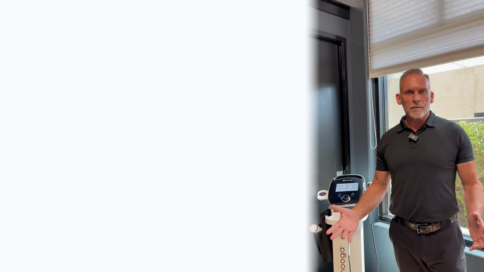 Dr. Steve Van Laecken DC standing beside the shockwave therapy unit at SpinalWorks Chiropractic